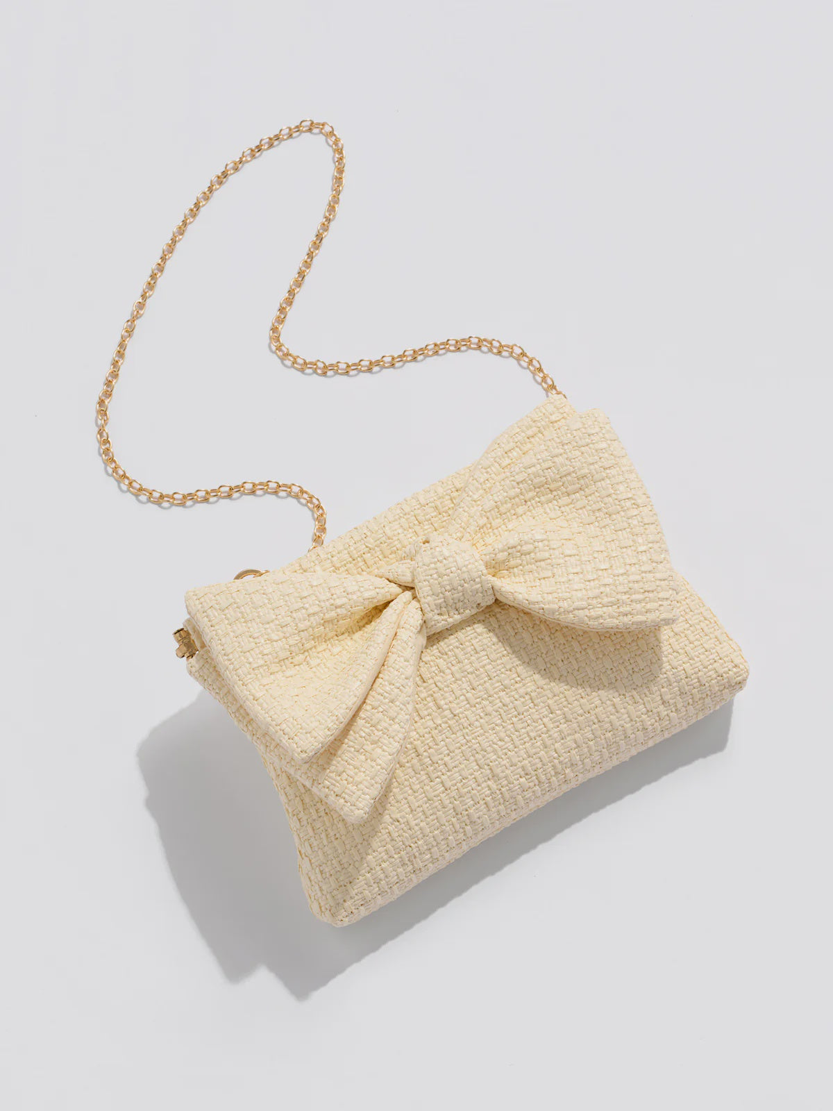 VERA BOW CLUTCH in Ivory